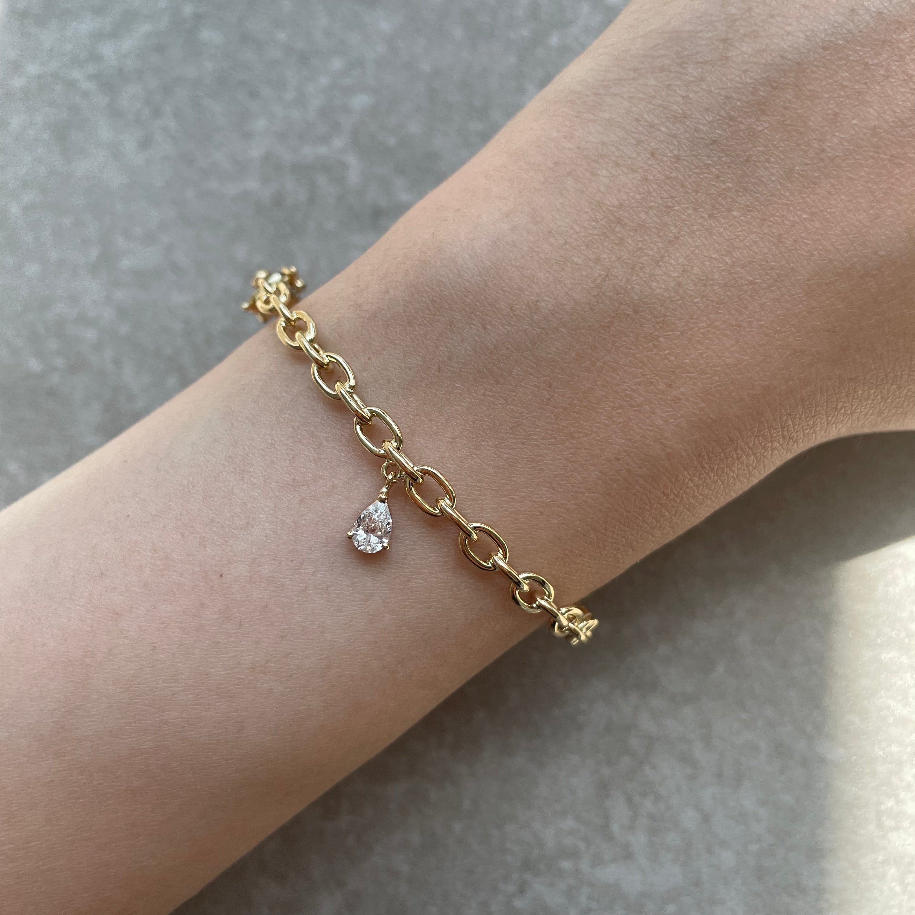 YELLOW GOLD TRAILBLAZER BANGLE WITH PEAR DIAMOND CHARM